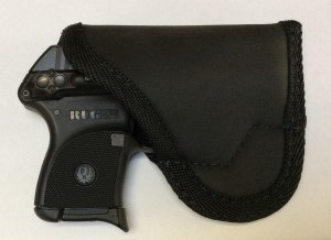 Reverse of the SM-2 Sticky Holster with the LCP in place. I think this is the best solution for LCP pocket carry if you DO NOT have the LaserLyte in place. With it, the fit is on the snug side and you could find yourself wearing the wrong king of protection on a fast draw.
